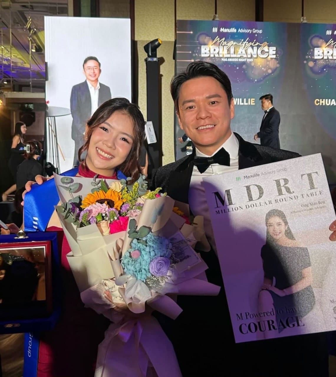 Xiao Jing with her MDRT award